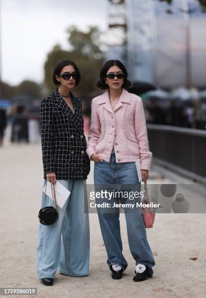 Guests are seen outside Chanel show wearing black Chanel sunnies, rose tweed Chanel jacket, black and white checkered tweed Chanel blazer, oversized...