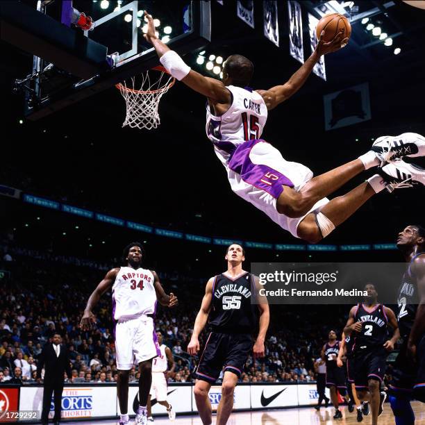 Vince Carter of the Toronto Raptors soars in for a slam dunk during the 2000 NBA game against the Cleveland Cavaliers in Toronto, Canada. NOTE TO...
