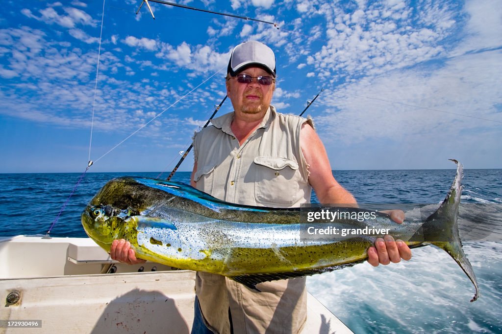 Middle Aged Caucasian Fisherman with Mahi-Mahi, Dorado or Dolphin Fish