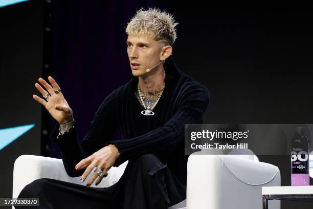 Machine Gun Kelly speaks during the 2023 Forbes 30 Under 30 Summit at Cleveland Public Auditorium on October 10, 2023 in Cleveland, Ohio.