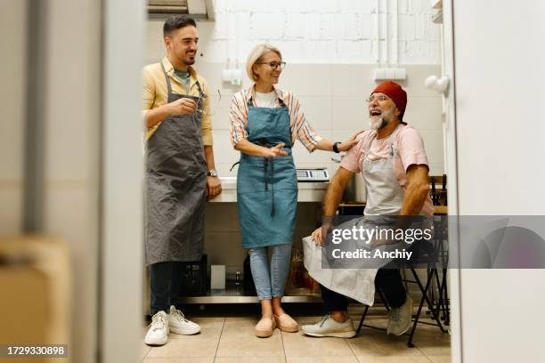 family talking about their business in the kitchen - italian mother kitchen stock pictures, royalty-free photos & images