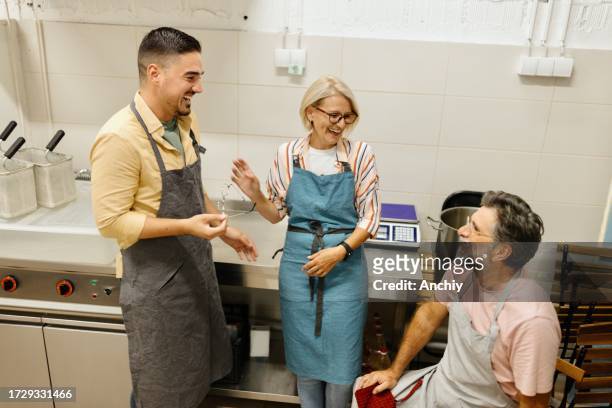 family business - italian mother kitchen stock pictures, royalty-free photos & images