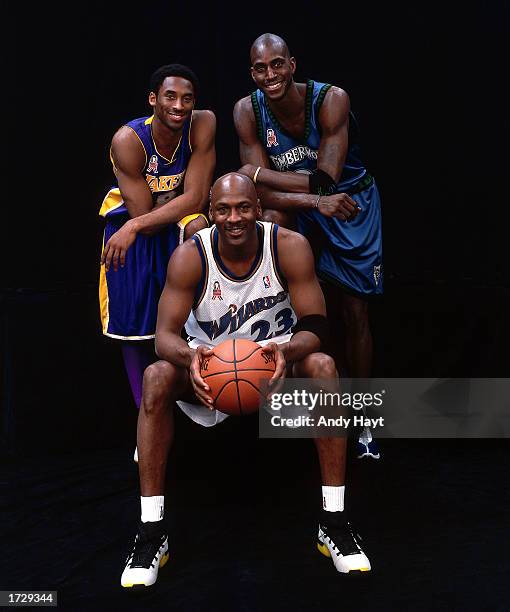 Michael Jordan of the Wizards poses for a portrait with Kobe Bryant and Kevin Garnett during the 2002 NBA All-Star Week at the First Union Center on...