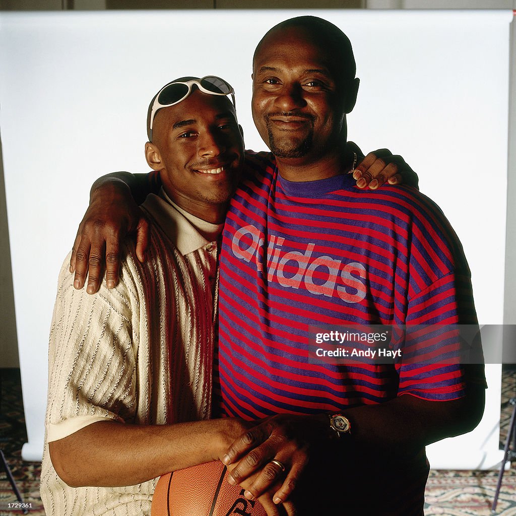 Bryant and father pose for a portrait