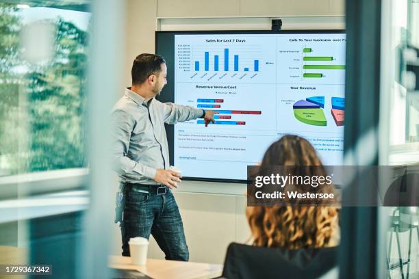 man explaining some graphs on a screen - jade stock pictures, royalty-free photos & images