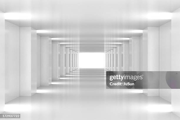 all white corridor ends in bright light - white corridor stock pictures, royalty-free photos & images