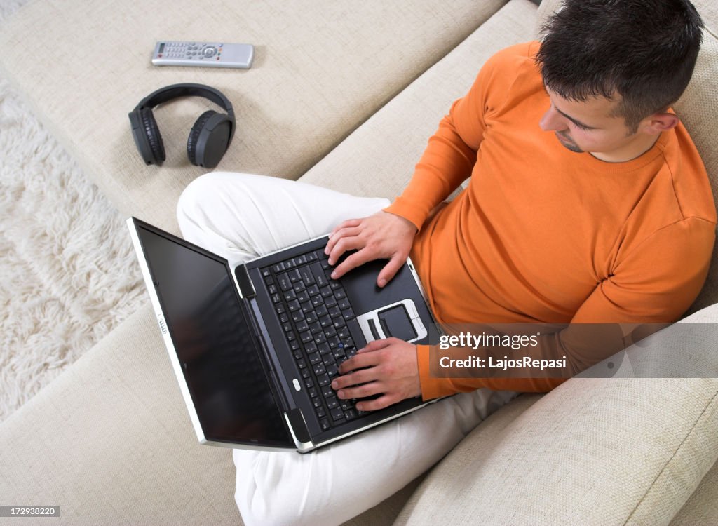 Young man working or studying at home