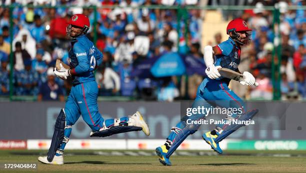 Hashmatullah Shahidi and Azmatullah Omarzai of Afghanistan look on during the ICC Men's Cricket World Cup India 2023 between India and Afghanistan at...