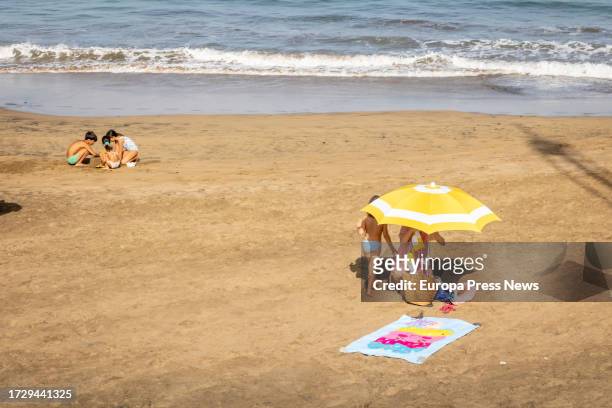 Several people on the beach during the suspension of classes due to the heat wave, on 11 October, 2023 in Las Palmas de Gran Canaria, Gran Canaria,...