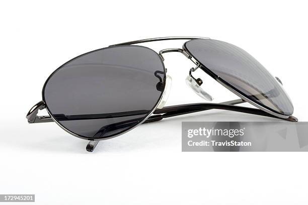 isolated sunglasses with folded earpieces - aviator sunglasses stock pictures, royalty-free photos & images