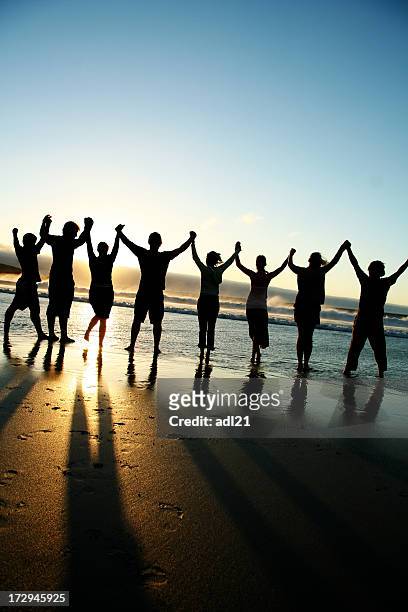 united we stand - group praying stock pictures, royalty-free photos & images
