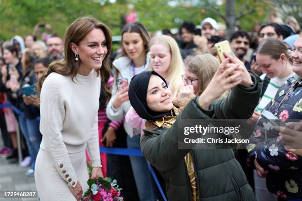 Catherine, Princess of Wales takes selfies with members of the public after a visit to Nottingham Trent University to learn about their mental health...