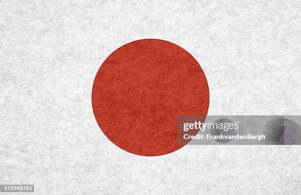 japanese flag on mottled paper - japanese flag stock pictures, royalty-free photos & images