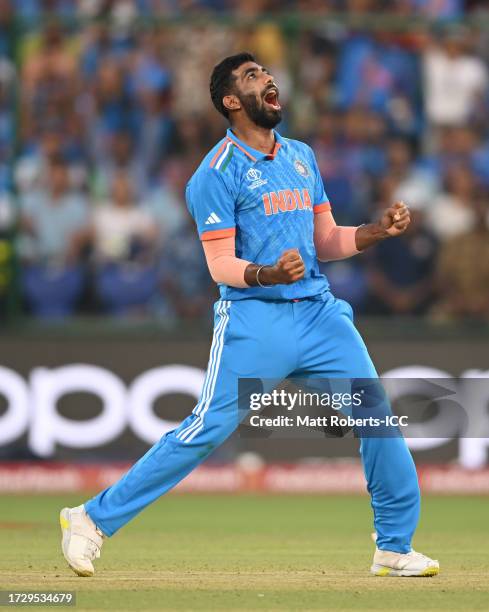 Jasprit Bumrah of India celebrates the wicket of Mohammad Nabi of Afghanistan during the ICC Men's Cricket World Cup India 2023 between India and...