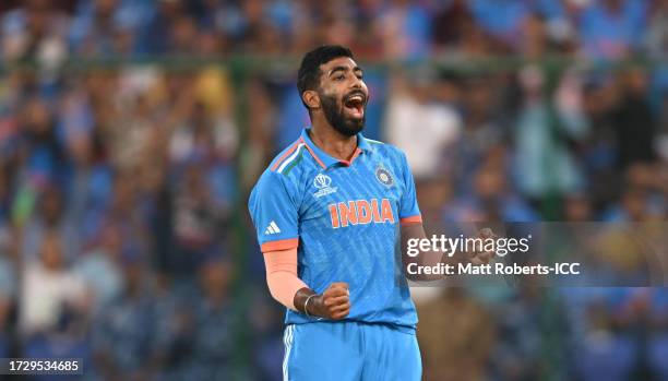 Jasprit Bumrah of India celebrates the wicket of Mohammad Nabi of Afghanistan during the ICC Men's Cricket World Cup India 2023 between India and...