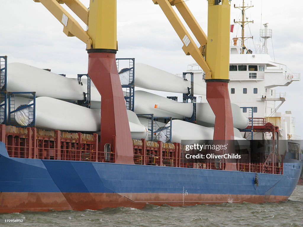 Cargo ship delivering wind turbine blades.