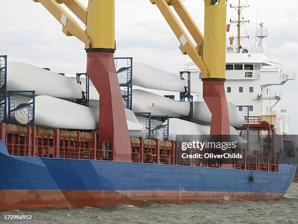 cargo ship delivering wind turbine blades. - blade stock pictures, royalty-free photos & images