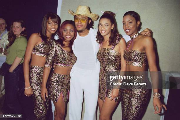 American musician Maxwell poses with American musical girl group Destiny's Child at a launch party held at the Aquarium for Maxwell's album 'Embrya',...