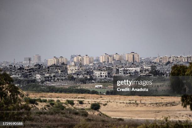 Destroyed buildings in Gaza are seen from the Sderot city as the Israeli airstrikes continue on October 17 in Sderot, Israel.