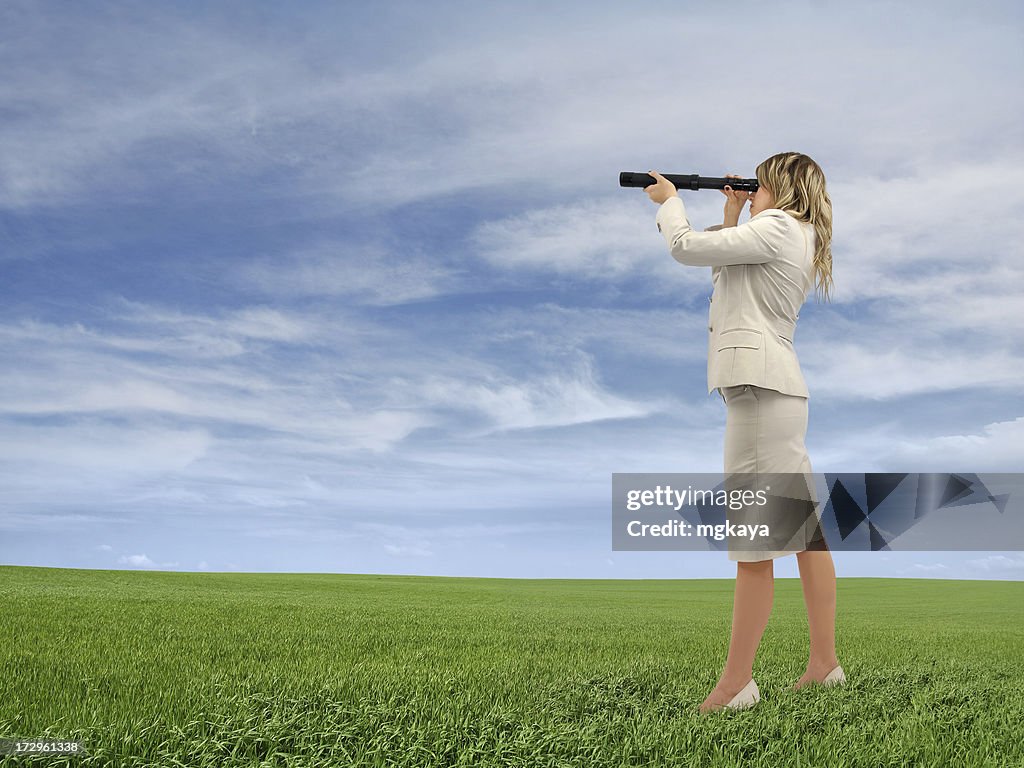 Businesswoman Looking Through a Telescope