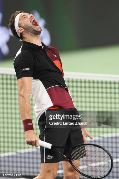 Grigor Dimitrov of Bulgaria celebrates victory in the Men's Singles Round of 16 match against Carlos Alcaraz of Spain on Day 10 of the 2023 Shanghai...