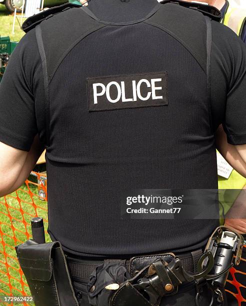 policeman, back view - police uniform stock pictures, royalty-free photos & images