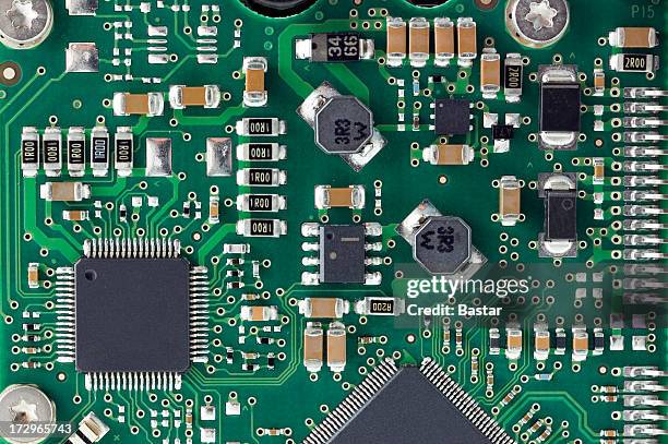 closeup of details on a circuit board - circuit board stock pictures, royalty-free photos & images