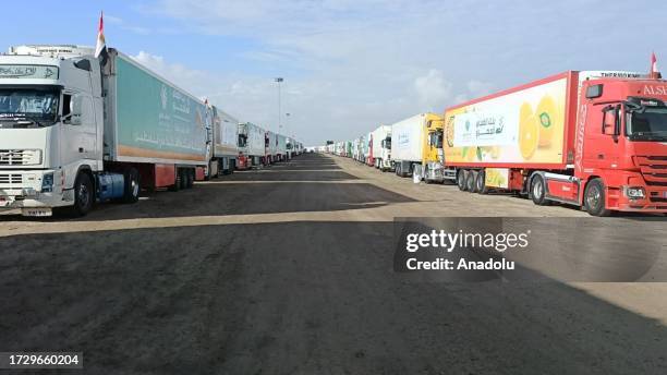 Trucks loaded with humanitarian aid supplies are seen at the Rafah crossing to be transported to Gaza Strip from Rafah, Egypt on October 17, 2023.