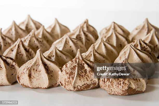 chocolate meringue cookies dusted with cocoa - meringue stock pictures, royalty-free photos & images