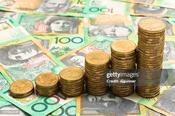 six stacks of gold coins shows growing funds - australian dollars stockfoto's en -beelden