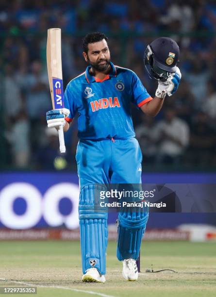 Rohit Sharma of India celebrates their century during the ICC Men's Cricket World Cup India 2023 between India and Afghanistan at Arun Jaitley...