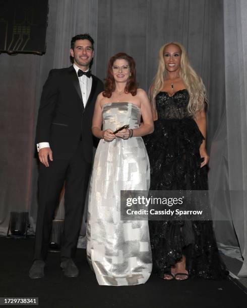 Adam Braun, Debra Messing and Kailee Scales attend The 15th Anniversary Pencils of Promise Gala at The Ziegfeld Ballroom on October 10, 2023 in New...