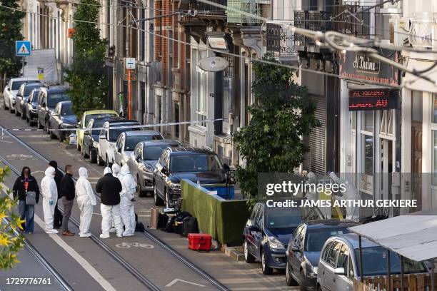 Illustration picture shows forensics near cafe Al Khaima in the Van Ooststraat/ rue Van Oost in Schaerbeek/ Schaarbeek, Brussels, where the suspected...