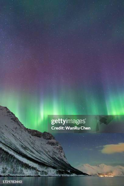 incredible aurora borealis activity above the coast in norway - norway money fotografías e imágenes de stock
