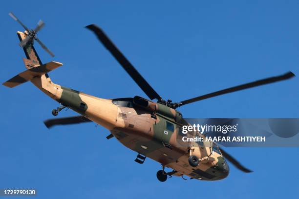 Jordanian Air Force UH-60 Black Hawk military transport helicopter carries the Palestinian president from West Bank city of Ramallah to Jordan on...