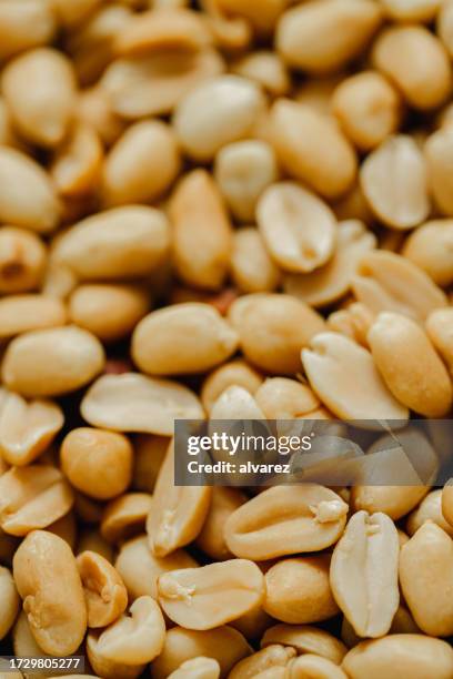 full frame of roasted peanuts - peeled stock pictures, royalty-free photos & images