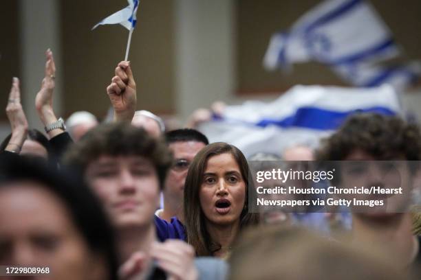 Adi Lutfak cheers during an event organized to support Israel in its fighting with Hamas on Monday, Oct. 9 at Congregation Beth Yeshurun in Houston....