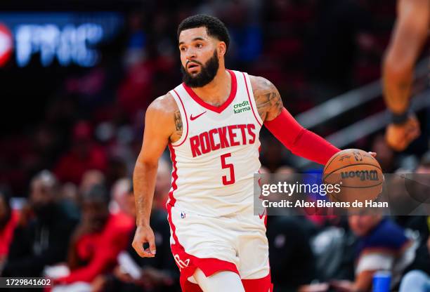 Fred VanVleet of the Houston Rockets dribbles the ball during the preseason game against the Indiana Pacers at Toyota Center on October 10, 2023 in...