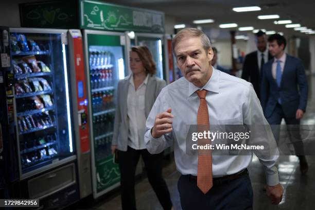 Rep. Jim Jordan walks with staff members to a conference meeting with House Republicans October 11, 2023 in Washington, DC. House Republicans are...