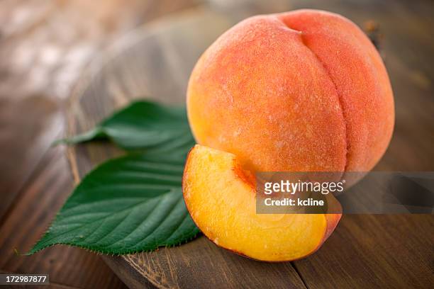fuzzy organic peach - juicy stock pictures, royalty-free photos & images