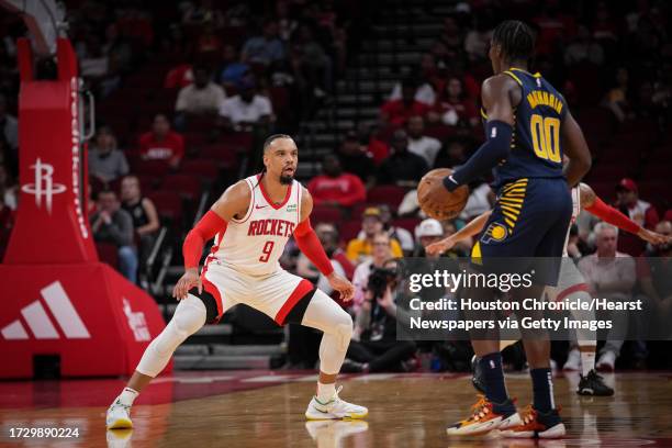 Houston Rockets forward Dillon Brooks defends Indiana Pacers guard Bennedict Mathurin during the first half of a pre-season NBA game Tuesday, Oct. 10...