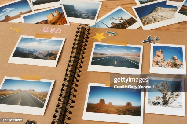 collection of instant film travel photos of the american west in a scrapbook - fotoalbum stockfoto's en -beelden