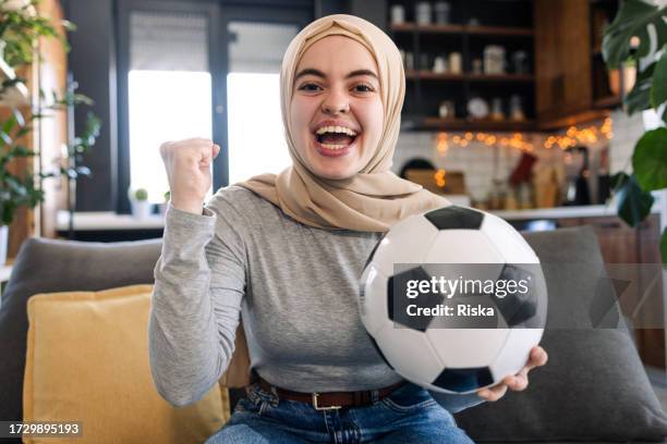 a female soccer fan celebrating during the match - finals game one stock pictures, royalty-free photos & images