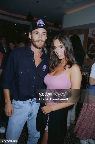 American actor Luke Perry and Northern Irish glamour model Kathy Lloyd attend an event at Planet Hollywood, London, 27th June 1994.