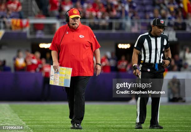 Kansas City Chiefs head coach Andy Reid speaks with a referee in the second quarter of the game against the Minnesota Vikings at U.S. Bank Stadium on...