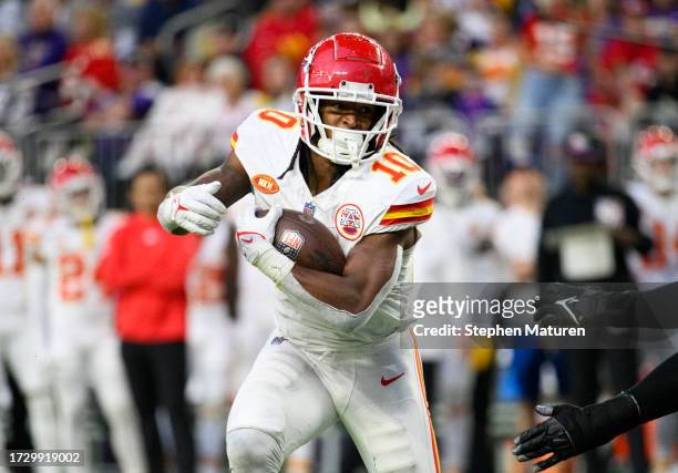 Isiah Pacheco of the Kansas City Chiefs runs with the ball in the third quarter of the game against the Minnesota Vikings at U.S. Bank Stadium on...