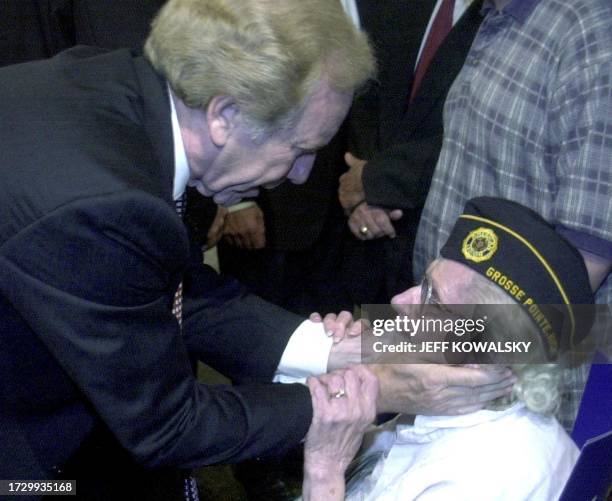 Democratic vice presidental candidate Joe Lieberman meets 79-year-old Elizabeth Hughes of Grosse Pointe Woods, MI, after a rally at the Southfield,...