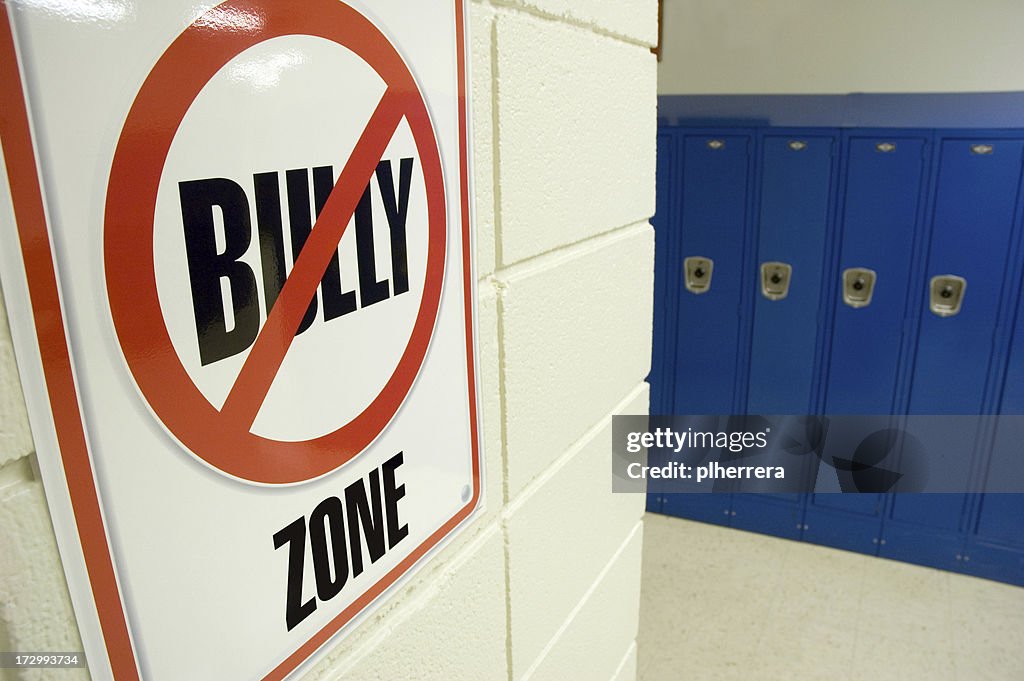 No Bullying Sign Located in School Hallway with Lockers