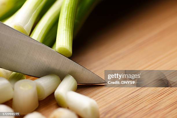 dicing onions - bosui stockfoto's en -beelden