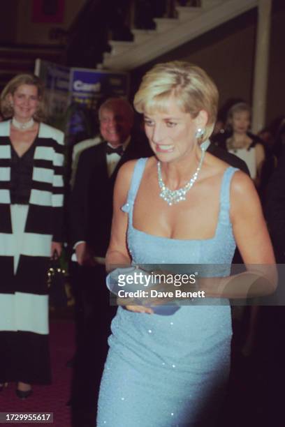 Diana, Princess of Wales wears a dress designed by Jacques Azagury at the English National Ballet's production of Swan Lake at the Royal Albert Hall,...